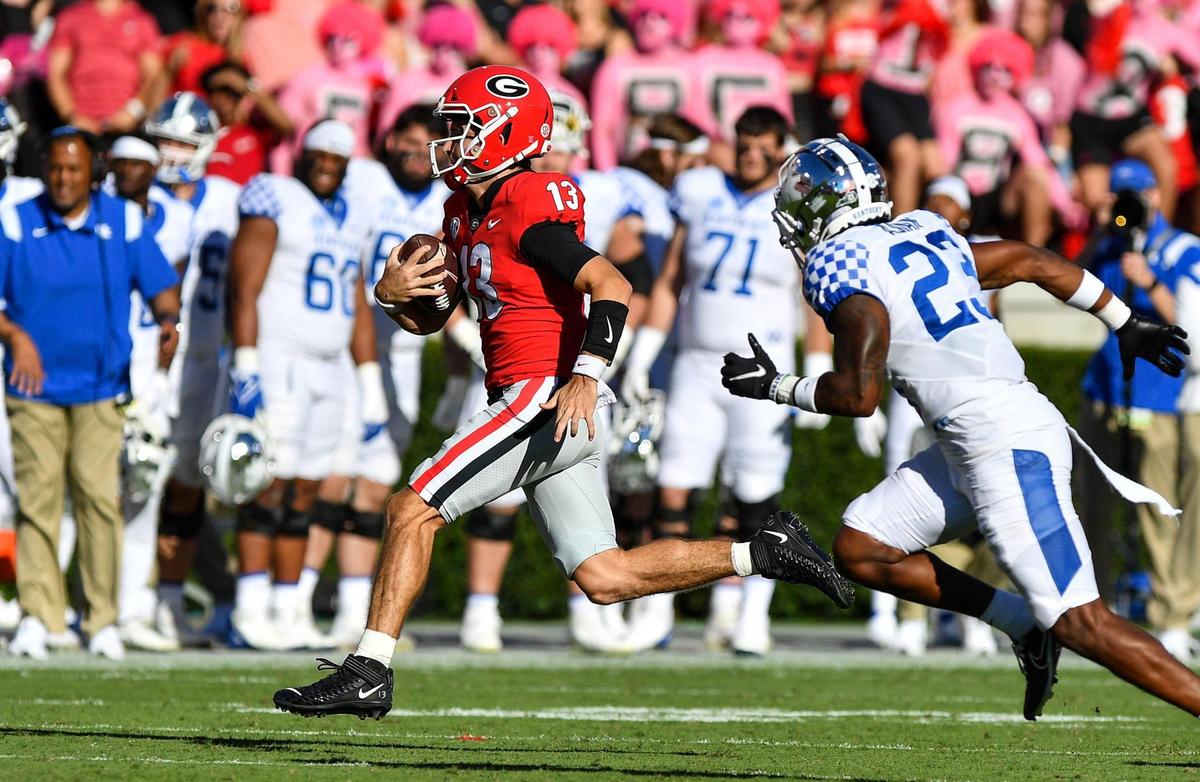 DONN RODENROTH,Athens, Georgia, 10/16/2021: Georgia quarterback Stetson Bennett scrambles for a first down against Kentucky Saturday.