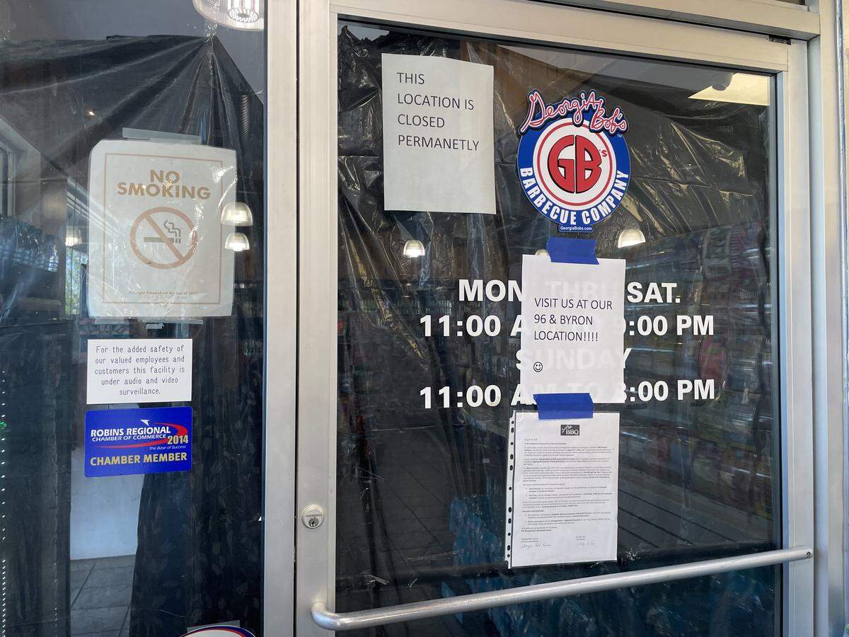 A letter from Georgia Bob’s Barbecue Company owners announcing the closing of the original Georgia Bob’s BBQ at 1882 Russell Parkway in Warner Robins is taped to the entrance door. The restaurant was nestled in the corner of a convenience store and gas station for 24 years.