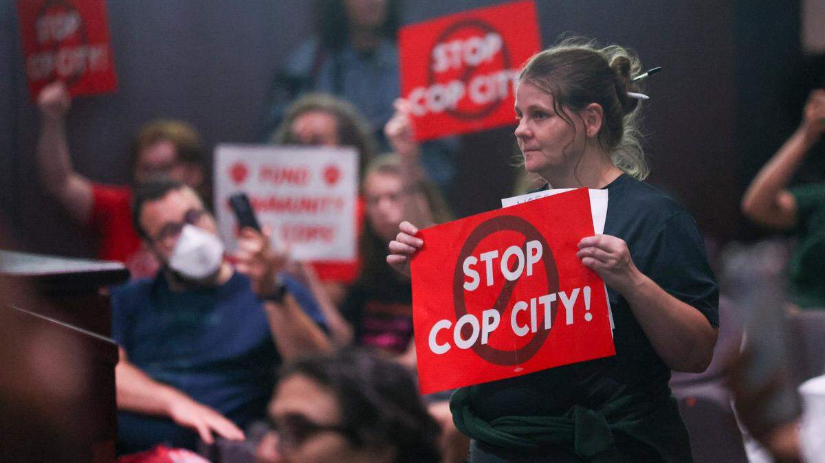 Protesters reacts before council members voted 11-4 to approve legislation to fund the Atlanta Public Safety Training Center June 6 in Atlanta. Sixty-one people have been indicted following a long-running state investigation into “Cop City” protests.