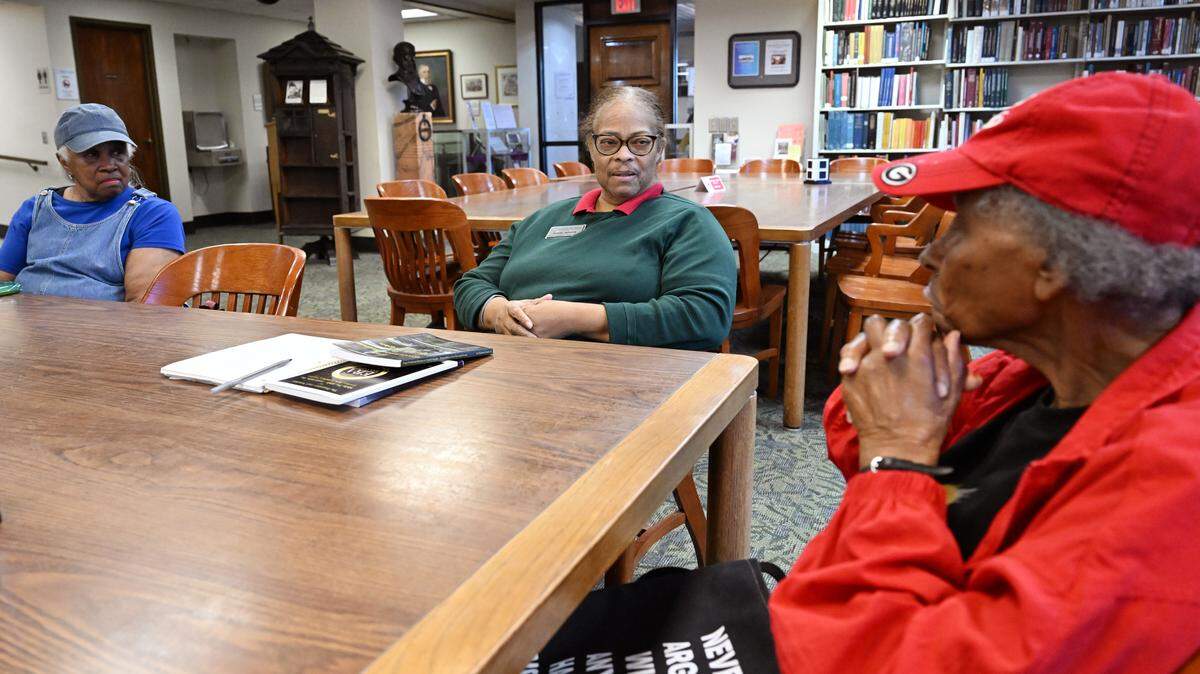 Genealogical and Historical room head Muriel Jackson (middle) speaks with members of the African American History Committee during a monthly meeting on Tuesday, Feb. 17, 2026, at Washington Memorial Library in Macon, Georgia. Attendees discussed pieces of family and local history during the informal meeting.