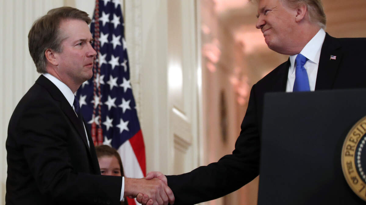 President Donald Trump shakes hands with Judge Brett Kavanaugh, his Supreme Court nominee, in the East Room of the White House on Monday in Washington.