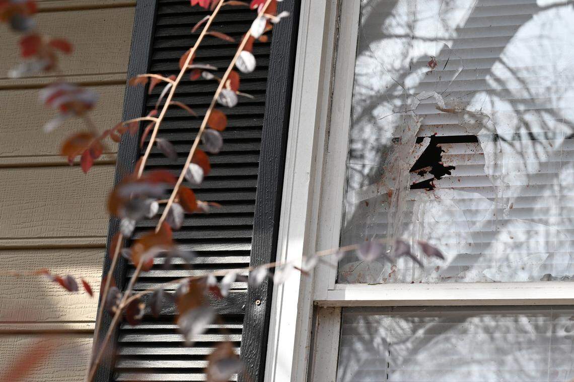A shattered window with what appears to be blood sits in the front of the home on Ridgeview Drive in the Lake Wildwood neighborhood on Wednesday, Feb. 18, 2026, in Macon, Georgia. A man allegedly killed his wife, daughter and pets, then himself, in their home in Macon after officers came to issue an eviction notice on Tuesday, Feb. 17.