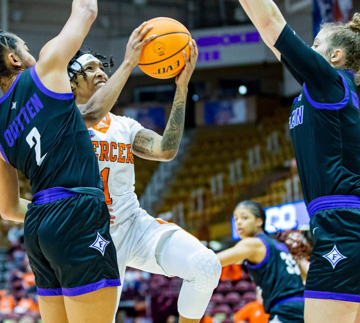 Mercer senior guard Amoria Neal-Tysor drives to the net against Furman Saturday afternoon in the SoCon Ingles Basketball Championships at the Harrah’s Cherokee Center in Asheville, N.C.