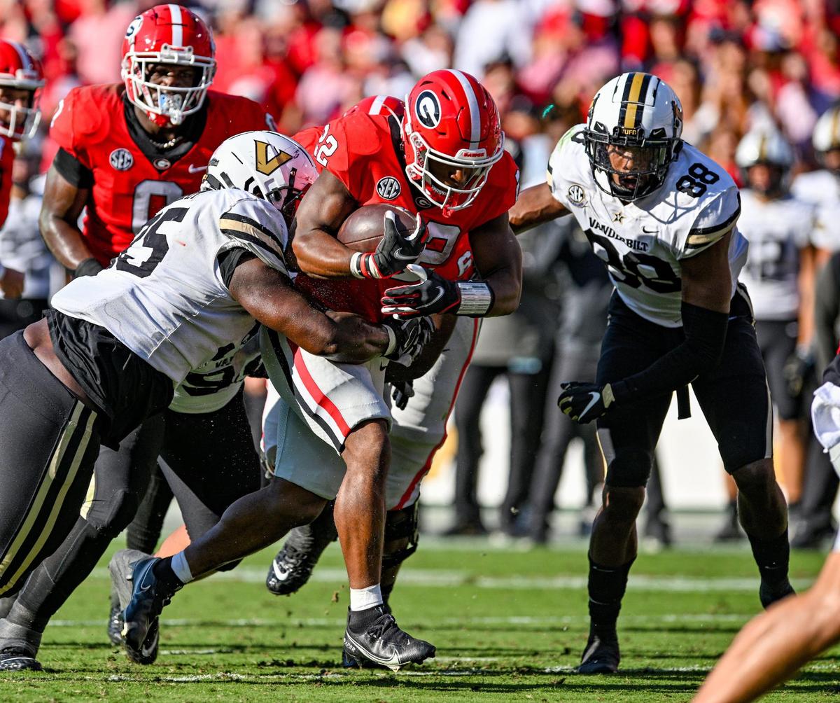 Georgia running back Branson Robinson comes out of the backfield with a full head of steam and heads for a Georgia first down. Georgia beat Vanderbilt 52-0 Saturday in Athens.