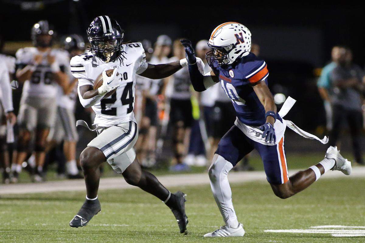 Houston County’s Ryan Taleb (24) stiffarms Northside’s (10) E.J. Riley during their game Friday night.
