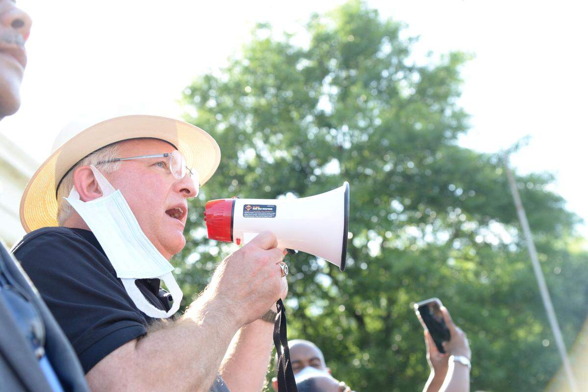 Bibb County Sheriff David Davis addresses protesters during a Black Lives Matter march in Macon in June of 2020. “I had to voice my outrage and anguish about what had happened,” Davis explained a year later.
