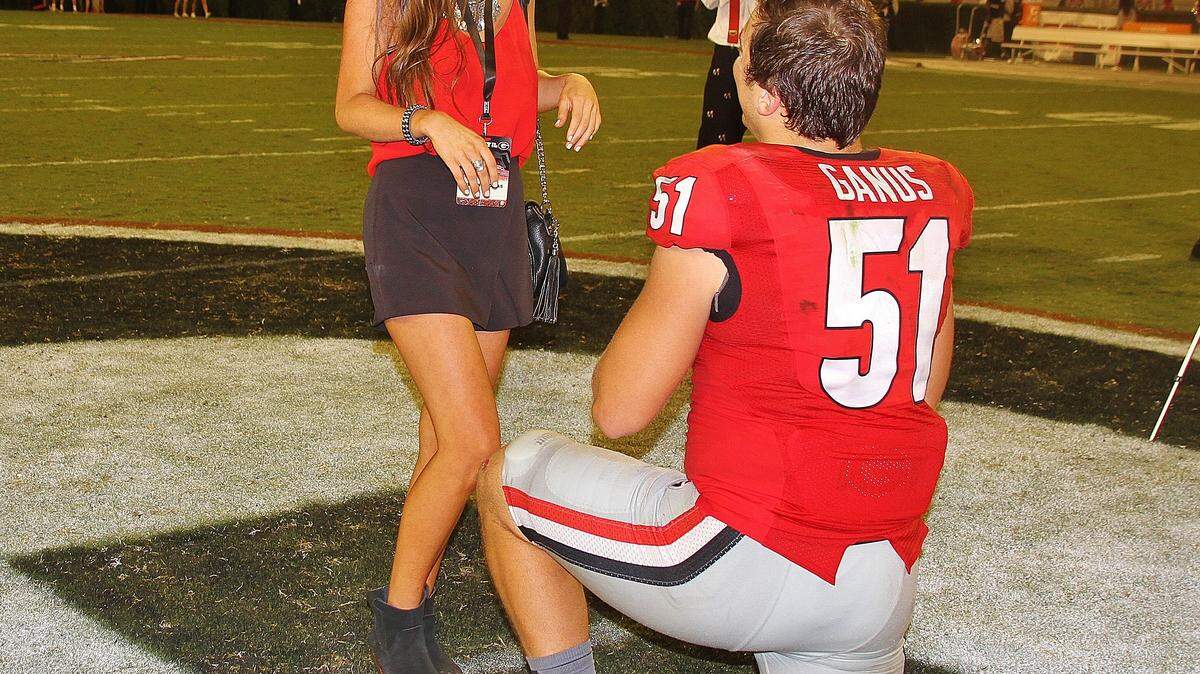 Georgia linebacker Jake Ganus (51) proposed to longtime girlfriend Peyton Thomas after the Bulldogs’ win over South Carolina on Saturday.