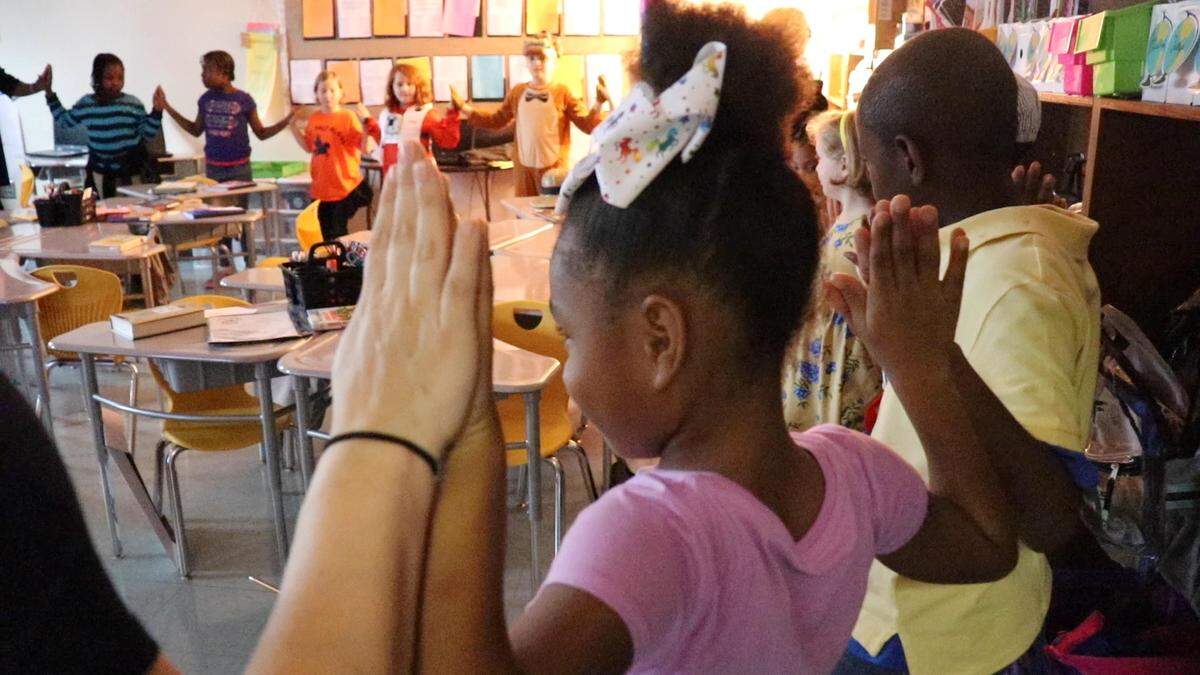 Students at Alex II Magnet School run through four minutes of breathing exercises on a recent morning. The students are participating in a pilot program that could expand to more Bibb County schools in 2020.