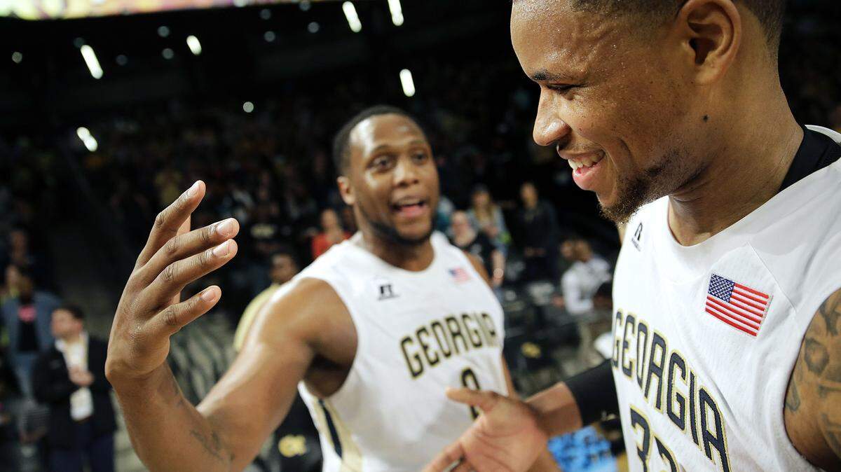 Georgia Tech's Nick Jacobs, right, celebrates with teammate Charles Mitchell after Tech beat Pittsburgh 63-59 in an NCAA college basketball game Saturday, March 5, 2016, in Atlanta. (AP Photo/David Goldman)