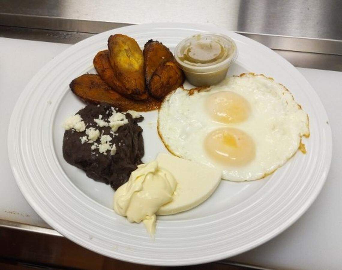 Eggs sunny side up with fried banana, black beans, cheese and sour cream at El Ranchito, a new authentic Mexican restaurant in Warner Robins.