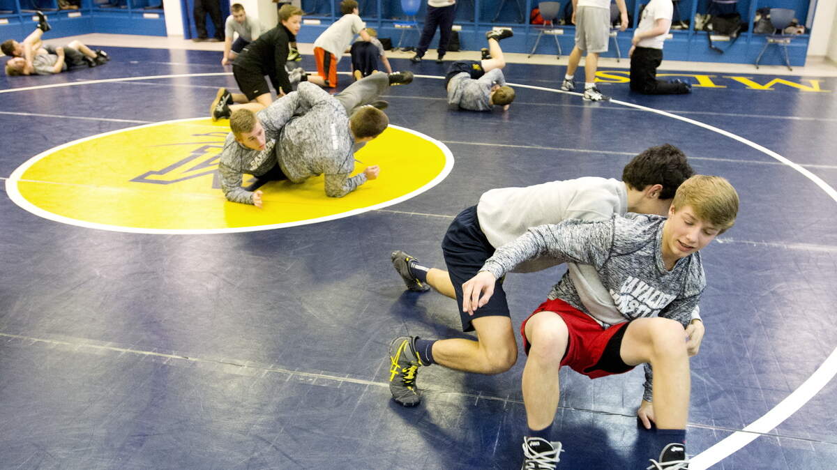 Mount de Sales wrestlers Christian Sims, front and Michael Garcia grapple during practice Tuesday.