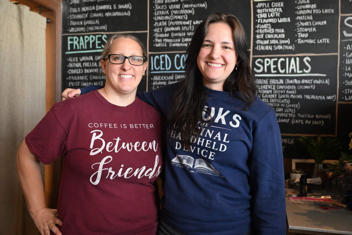 Between Friends Coffee owners Jaimie Miller (left) and Victoria Hawkins pose behind the counter at their literary themed coffee shop in Warner Robins. The café’s final day of operation is Saturday, June 13, 2026, after a 10-year run.
