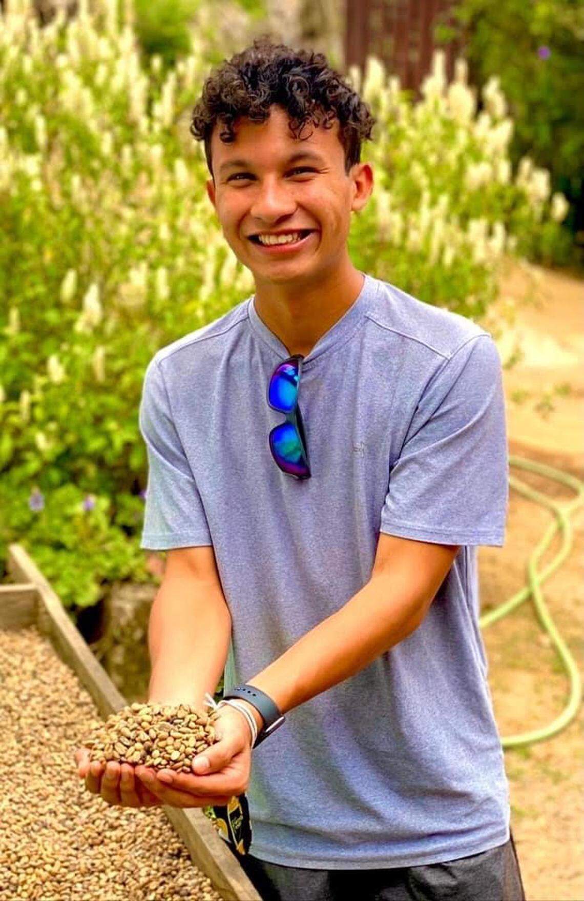 Henson Slade holding coffee beans from Honduran Pastor Donald Acosta‘s coffee plantation about 20 minutes up the mountain from Emmanuel Orphanage in Guaimaca, Honduras.