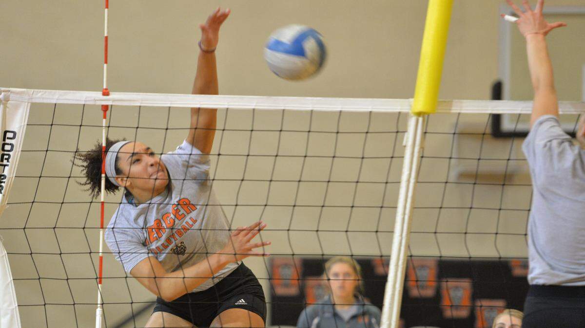 Monica Johnson practices her kill shot during the Mercer volleyball team practice.