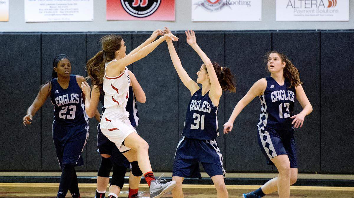 JASON VORHEES/THE TELEGRAPH Macon, GA, 0 1/22/2016: 
 FPD's Kate Patterson (5) passes out of pressure from Stratford's Ann Thompson (31) during their game Friday night.