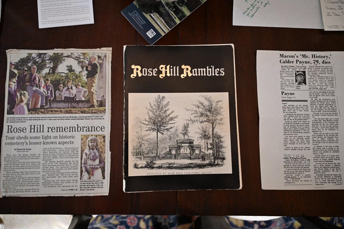 A book of the Rose Hill Rambles, written by the first Rose Hill Ramble guide Calder Willingham Payne in 1986, sits with a Telegraph clipping of Barfield’s tour on the dining room table of Jim Barfield in his home on Saturday, April 26, 2025, in Macon, Georgia.
