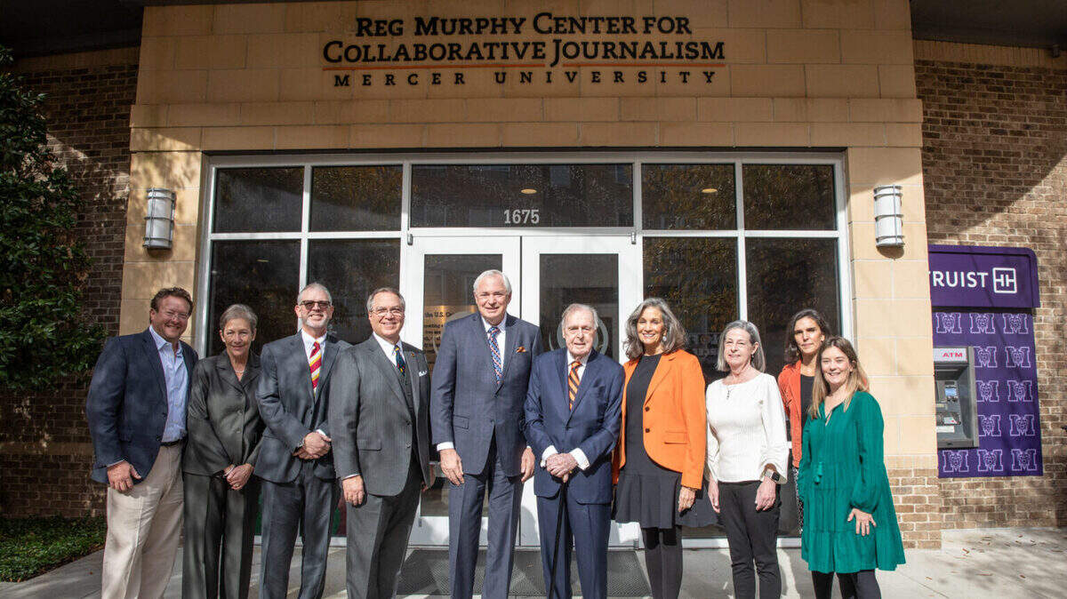 Mercer University named the Reg Murphy Center for Collaborative Journalism in honor of Mercerian and journalist J. Reginald “Reg” Murphy, fifth from right, in Macon, Ga. on Dec. 8, 2023. He is pictured with his family and Mercer officials, including President William D. Underwood, fifth from left.