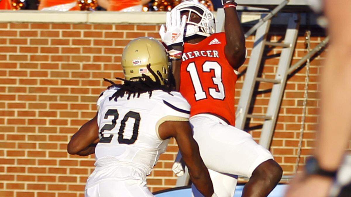 Mercer’s Ty James hauls in the pass for the Bear’s first score against Wofford