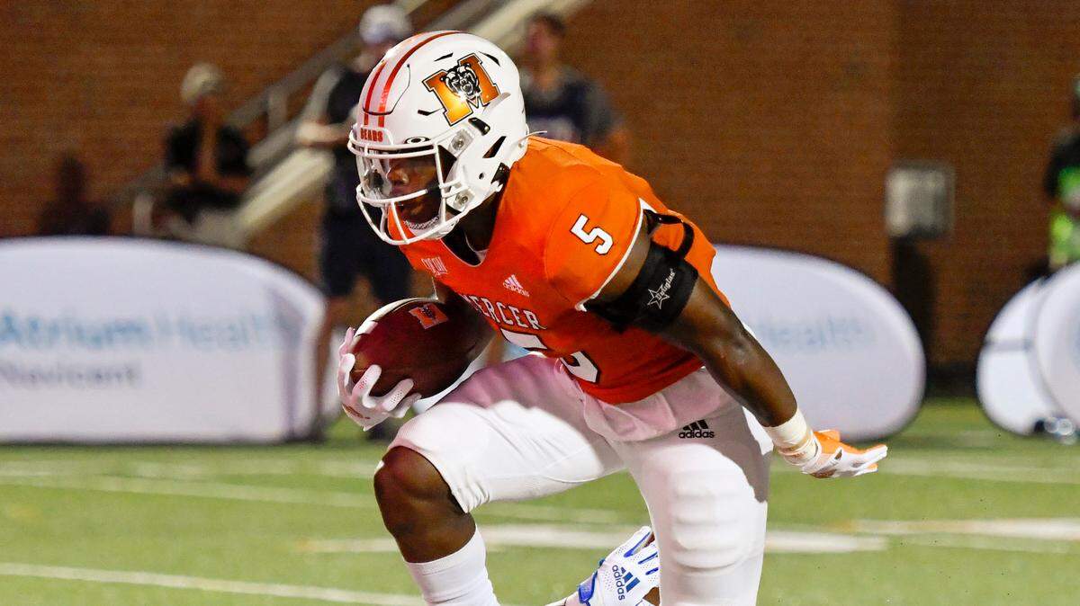 Mercer running back Fred Davis (5) runs over a Point defender for a touchdown during the Bears’ victory Thursday night.