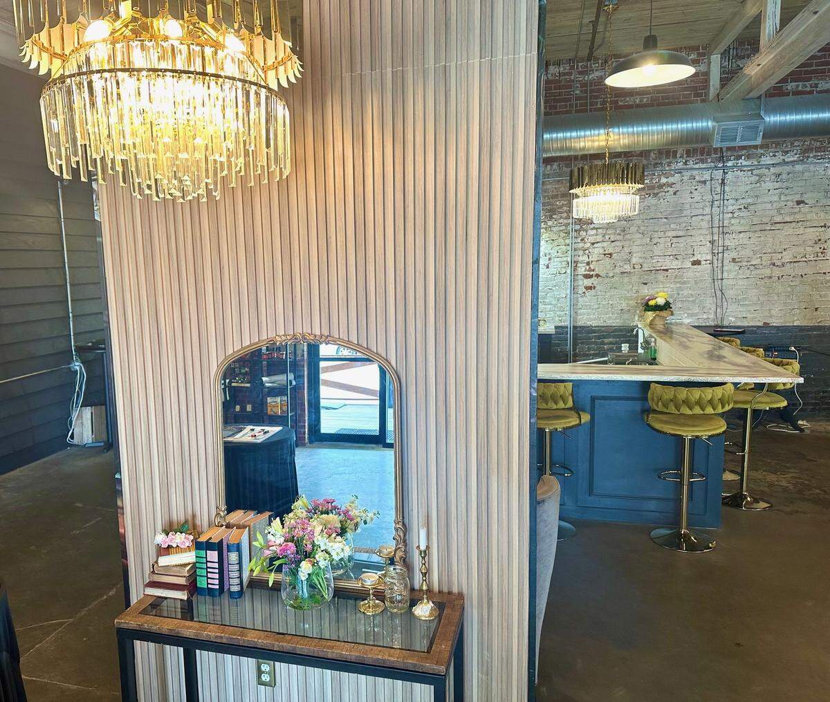 Inviting hostess area inside Her Majesty Kitchen in Forsyth.