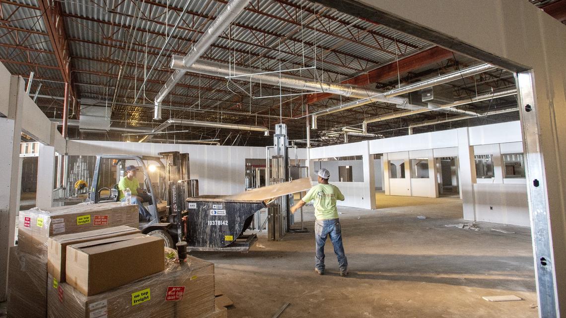 Subcontractors work Tuesday on the interior of the future Turner Furniture Co. located at the former Winn-Dixie in Bonaire.