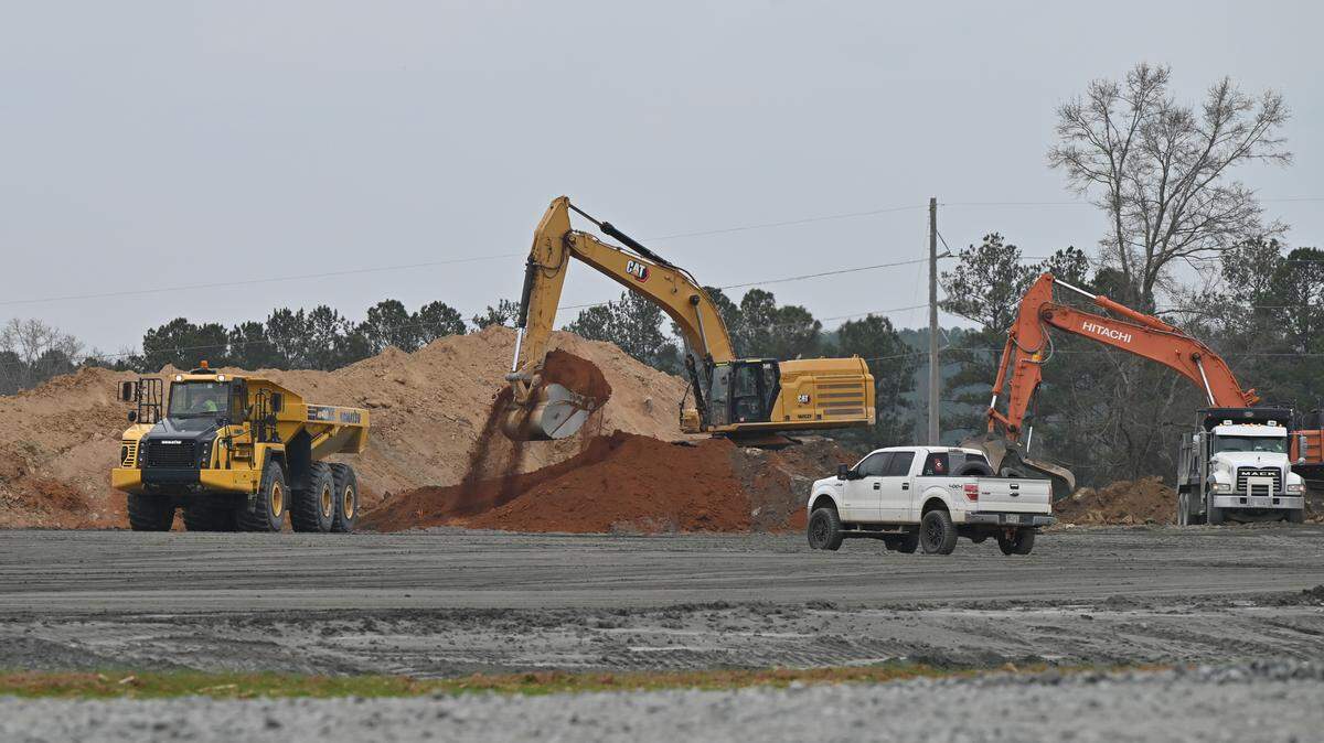 Excavators move dirt at the site for the new Buccee’s off of I-75 on Thursday, Jan. 8, 2025, in Forsyth, Georgia. The Buccee’s site is one major development project within Monroe County. 