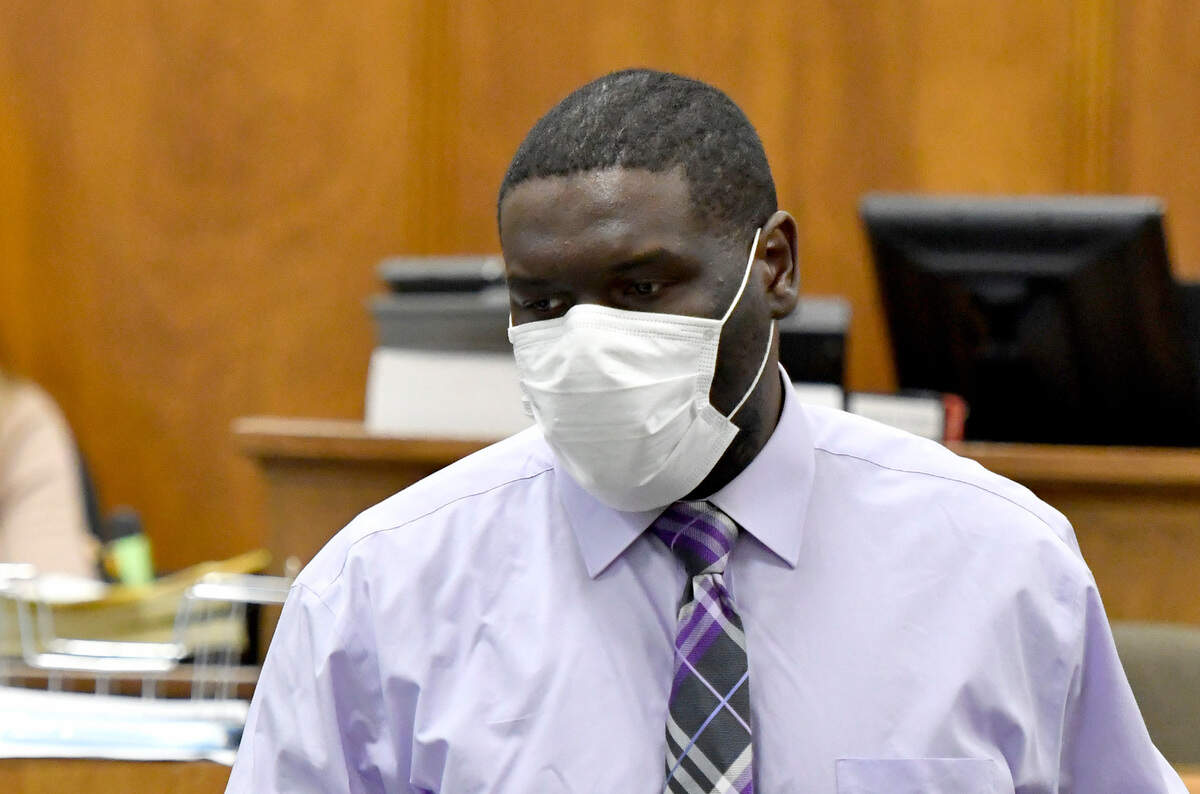 Trayvion Lamonte Burney walks back to his seat in a Bibb County courtroom Thursday. Burney was accused of killing and robbing Jackie Dewayne Rouse on Halloween night in 2017.
