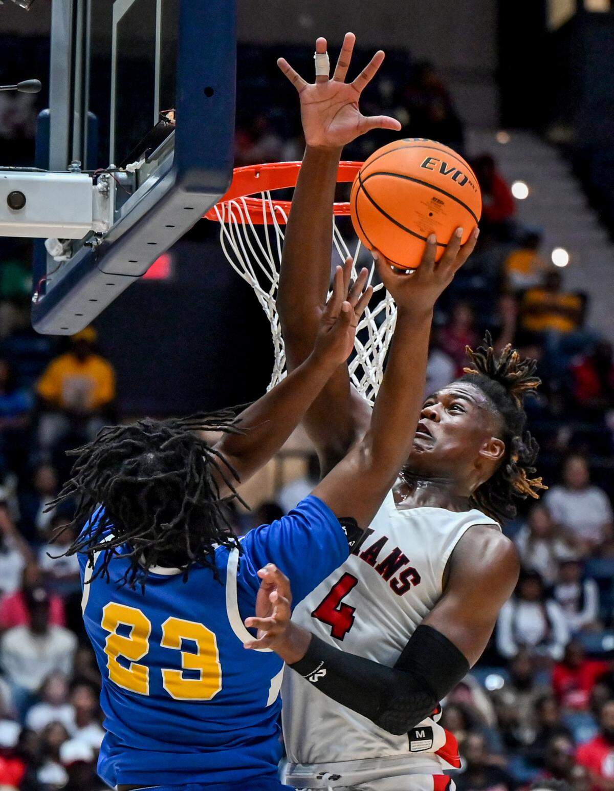 Wilkinson’s Jordan Jackson (24) has hi shot blocked by Charlton County’s Elyiss Williams (4) during their GHSA 1A D-II championship Wednesday in Macon.