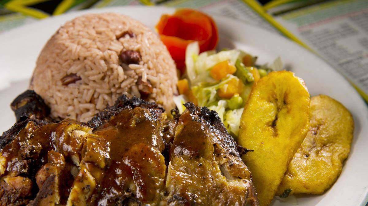 JASON VORHEES/THE TELEGRAPHJerk chicken with rice and beans, steamed vegetables and fried plantains are on the menu at J&F Caribbean Delight.