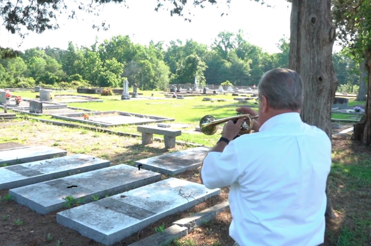 John Prettyman, a longtime minister of music at Central Fellowship Baptist in Macon, visits rural church cemeteries on Memorial Day and plays taps on his trumpet to honor the fallen.