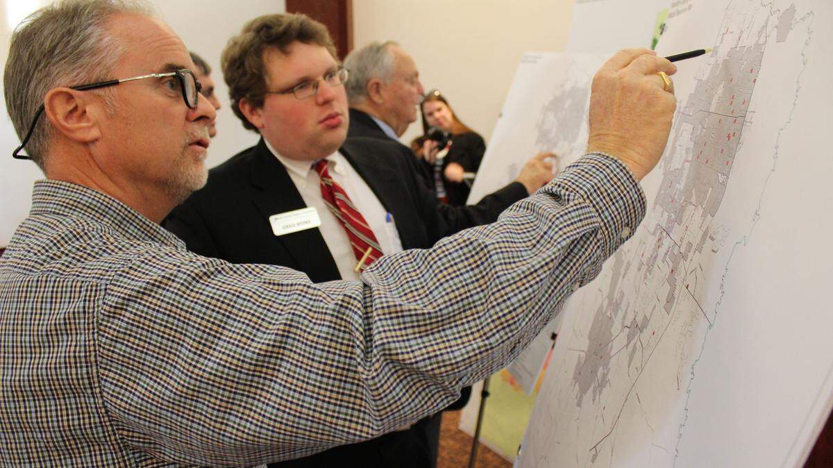 Robbie Dunbar, left, Houston County operations director, points out a potential growth area to Greg Boike of the Middle Georgia Regional Commission. The commission held a meeting Wednesday to discuss its 20-year plan for the region.