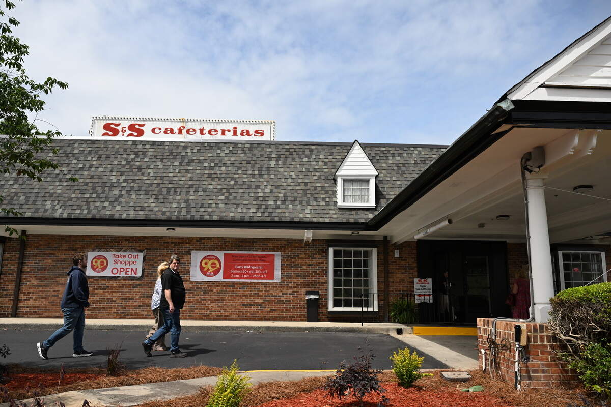 Customers walk into the S&S Cafeterias Riverside Drive location on its reopening day on Friday, May 1, 2026, in Macon, Georgia. S&S Cafeterias Riverside location reopened on Friday after 20 months of renovations following a fire.