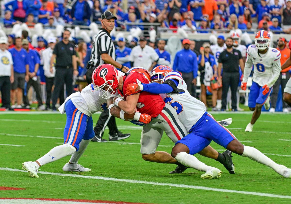Georgia receiver Ladd McCkonkey drags two Florida defenders in to the endzone for a Georgia touchdown as the Dawgs beat Florida 42-20.