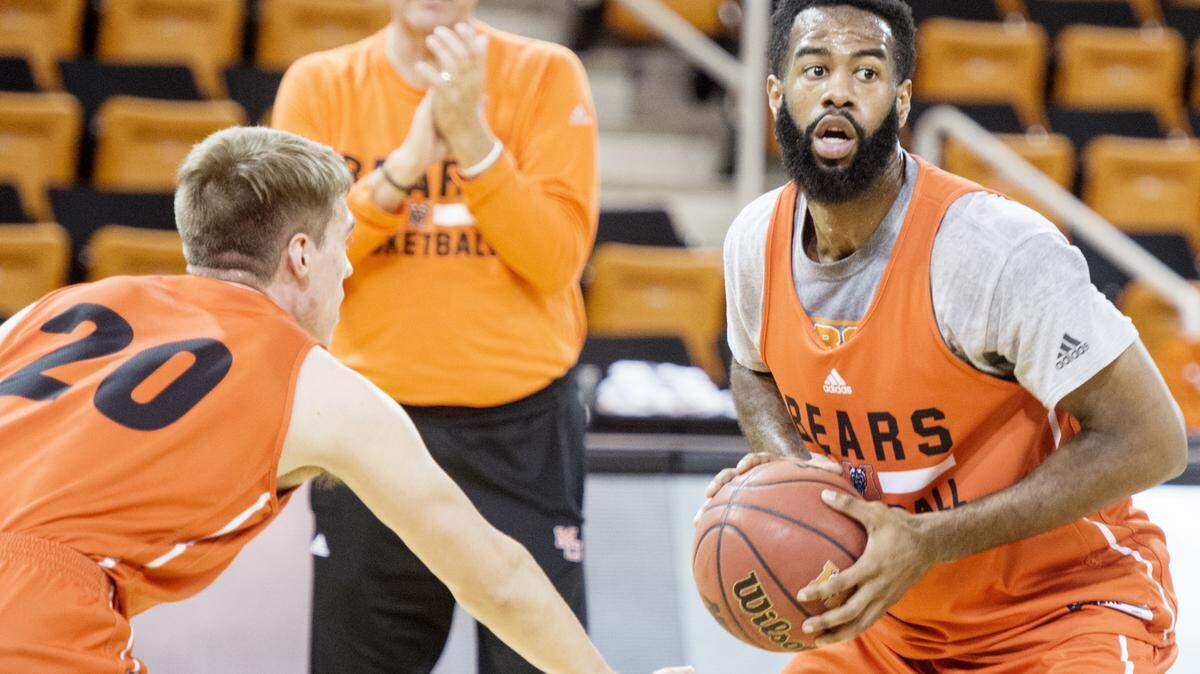 Mercer forward Desmond Ringer (0) guarded by teammate Cory Kilby (20) during practice October 28.