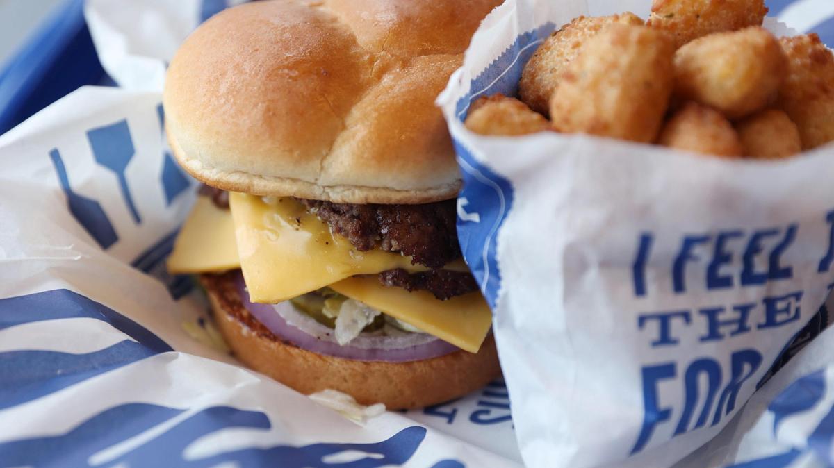 A deluxe butter burger with a side of Wisconsin cheese curds at Culver’s.