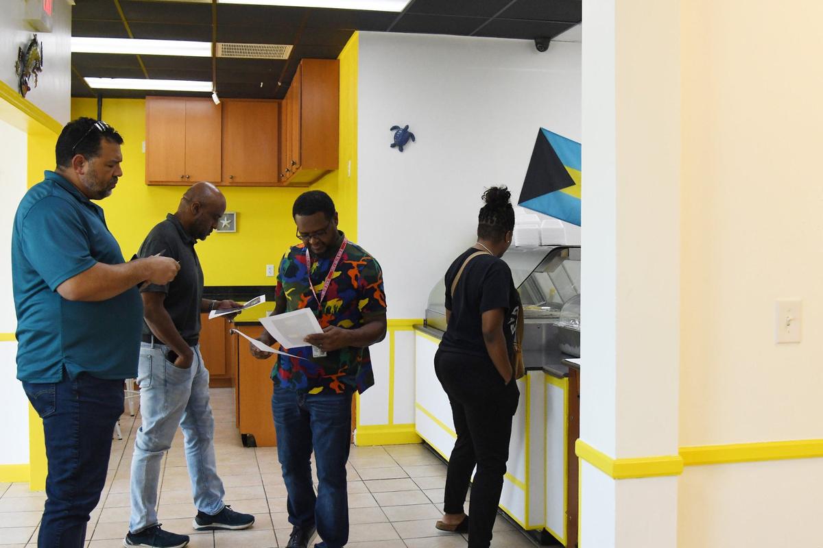 Customers wait in line inside of Bahamas Caribbean Cuisine on Thursday, Aug. 15, 2024, in Warner Robins, Georgia. The new restaurant serves authentic Bahamian food.
