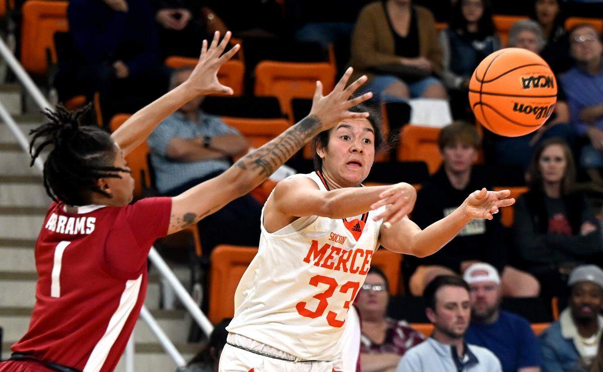 Mercer forward Summah Evans (33) passes the ball to a teammate during the Bears’ game against Alabama Nov. 30.