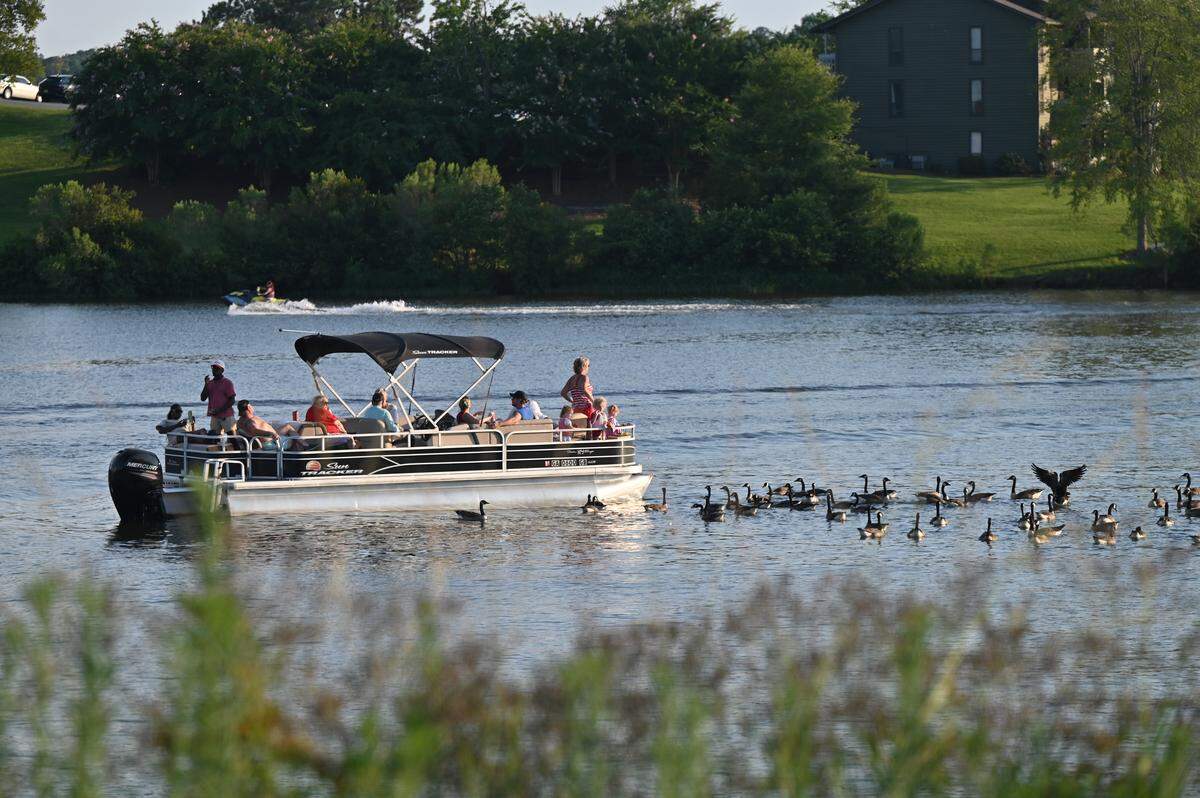 Boaters feed ducks on Lake Tobesofkee on Friday, July 4, 2025, in Macon, Georgia. Lake Tobesofkee is one of the Middle Georgia waterways with fish consumption adversaries due to mercury.