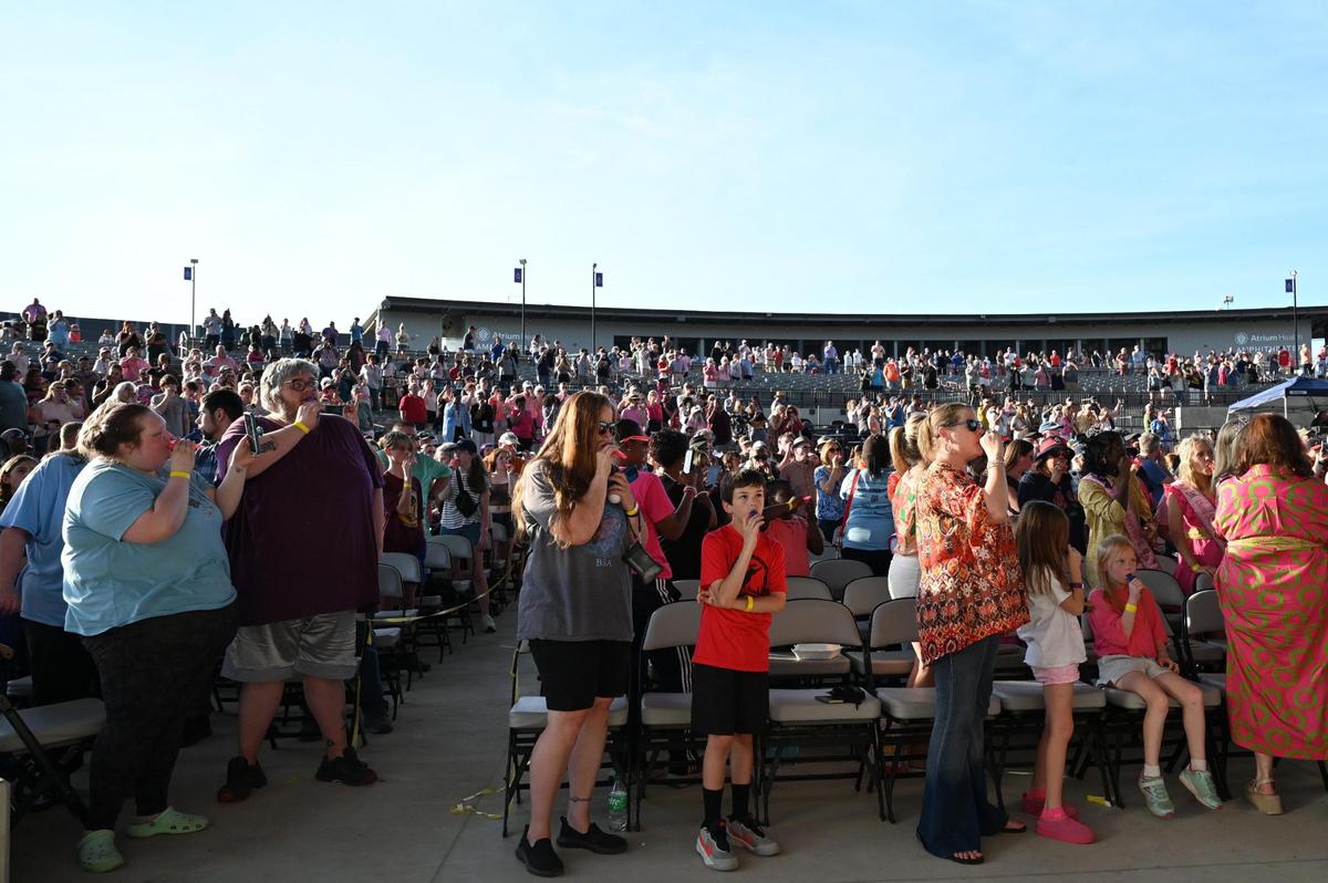 Participants play a medley of songs by Macon artists during the Guinness World Record attempt for largest kazoo ensemble on Friday, March 28, 2025, at the Atrium Health Amphitheater in Macon, Georgia. Over 1,000 participants came out for the event, but their third record attempt failed to meet the mark for the record.