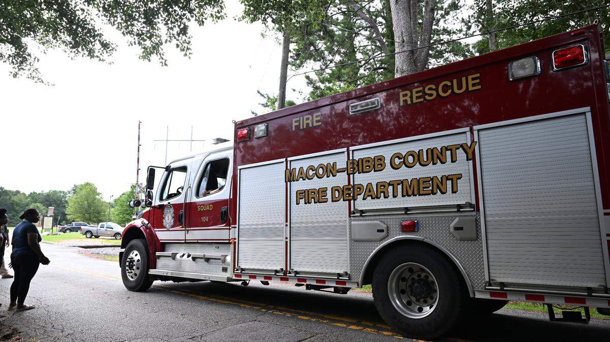 A Macon-Bibb County Fire Department truck drives through the gate at Amerson River Park on Wednesday, July 16, 2025, in Macon, Georgia. Three people went missing Tuesday evening while swimming in the Ocmulgee River at Amerson River Park and officials continued to search for them into Wednesday morning.