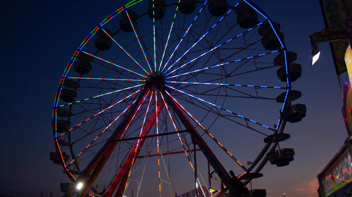 Ferris wheel lights up the midway  at the Georgia National Fairgrounds in Perry. 