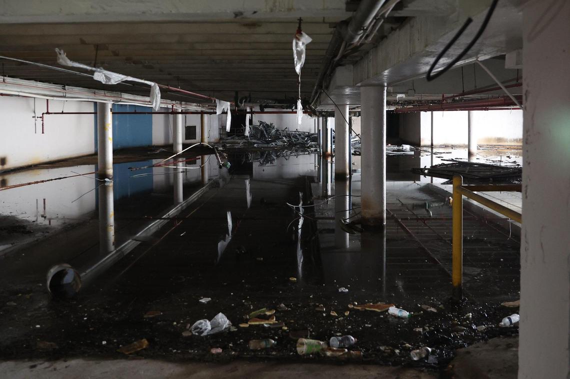 Debris floats in the basement of the abandoned Ramada Hotel on Thursday, Dec. 12, 2024, on Thursday, Dec. 12, 2024 in downtown Macon, Georgia. Construction crews are preparing the 16-story hotel for a controlled implosion on New Year’s Day at 9 a.m.