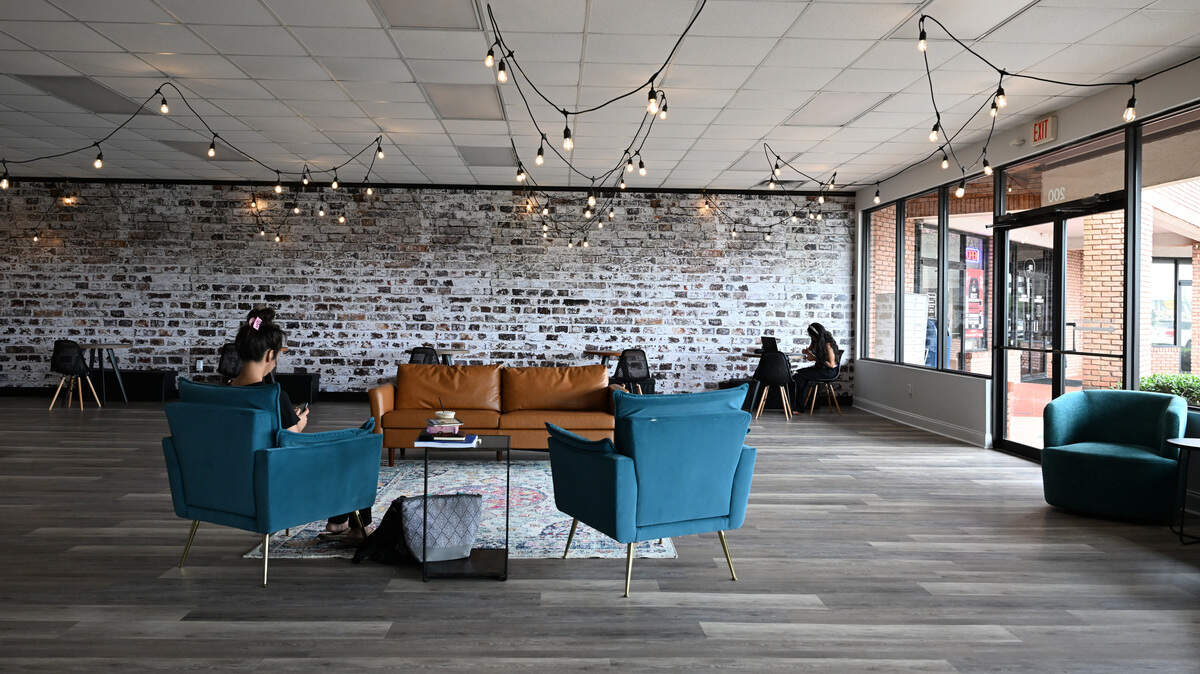 Customers sit inside of the new “third space” of Little Light Coffee Co. on Wednesday, July 30, 2025, in Warner Robins, Georgia. The new space, which officially opened Aug. 1, is connected to the original shop.