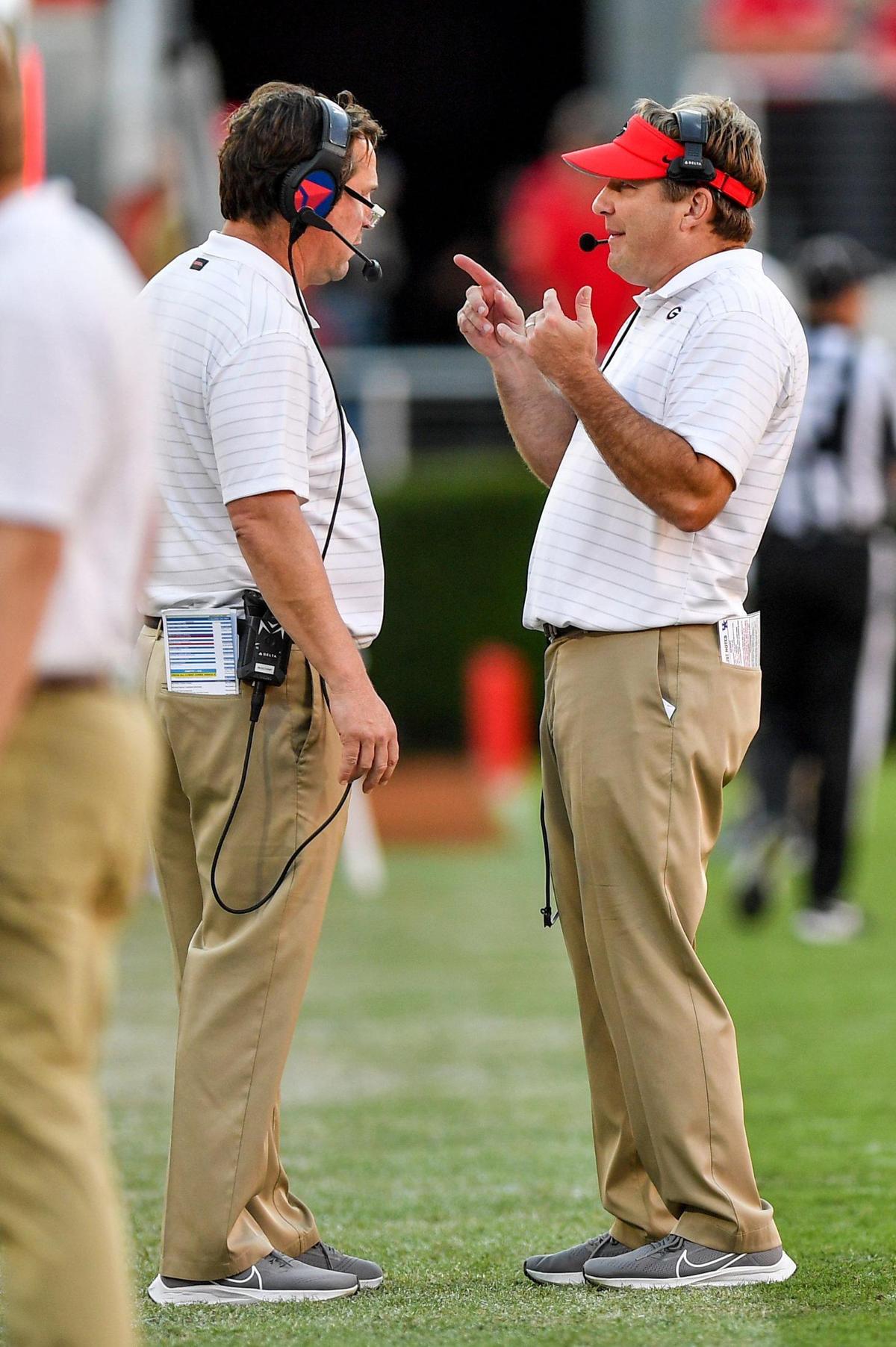 DONN RODENROTH,Athens, Georgia, 10/16/2021: Coach Kirby Smart talks with Will Muschamp late in the 3rd quarter. The bulldogs beat Kentucky 30-13.