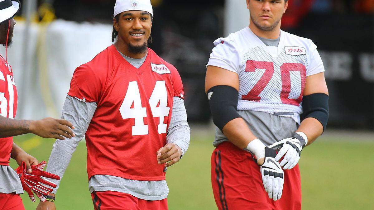Atlanta Falcons first round draft picks Vic Beasley Jr. (44) and Jake Matthews (72) take the field for NFL football training camp, Wednesday, Aug. 19, 2015, in Flowery Branch, Ga. (Curtis Compton/Atlanta Journal-Constitution via AP)