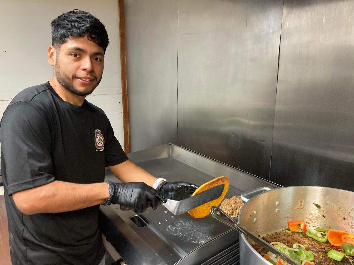 Co-owner Eduardo Barcenas at the grill at Sabor Latino Venezuelan Restaurant, a new spot in Warner Robins.