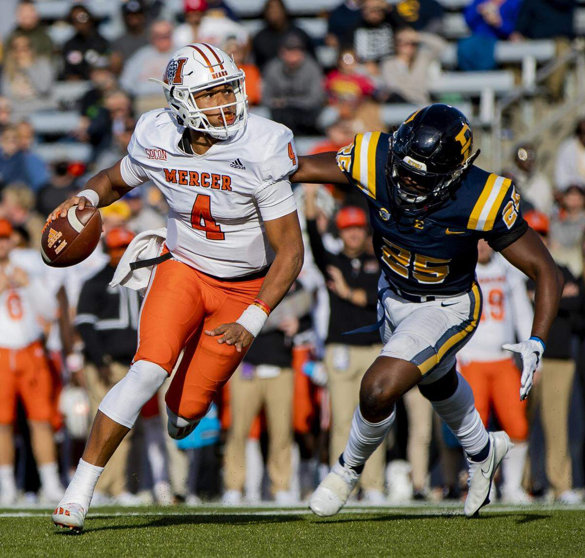 Mercer junior quarterback Fred Payton scrambles against Eastern Tennessee State Saturday afternoon at William B. Greene Jr. Stadium in Johnson City, Tenn. ETSU defeated Mercer 38-35.