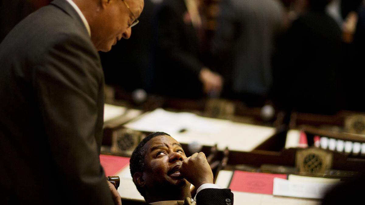 State Rep. James Beverly, D-Macon, right, talks with Rep. Ed Rynders, R-Albany, on the House floor during the first day of the legislative session.