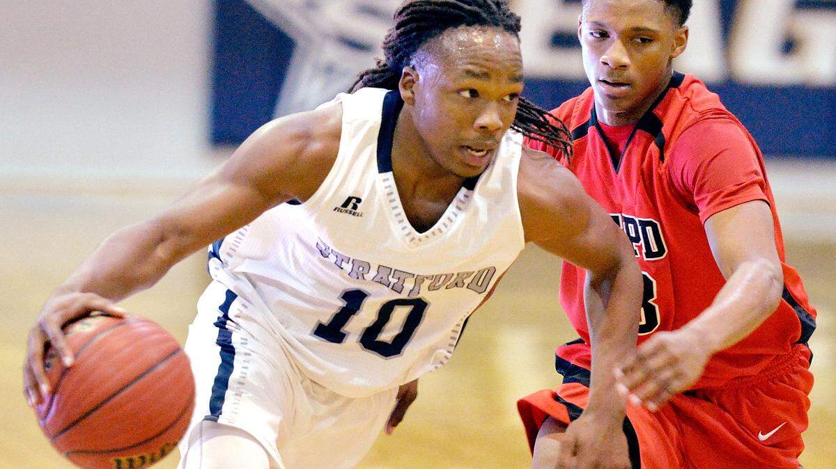 Stratford's O'Showen Williams (10) drives by FPD's Armaun Smith (3) during their game Tuesday night.