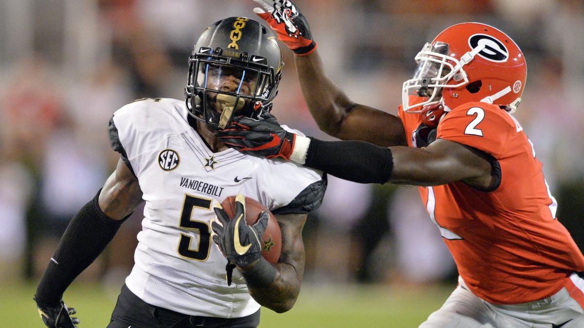 Georgia defensive back Richard LeCounte III (2) catches Vanderbilt running back Ke’Shawn Vaughn (5) from behind on a 7-yd. run in the first quarter.  Georgia beat Vanderbilt, 41-13.
